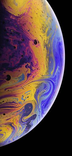 an iphone with colorful liquid paint on it