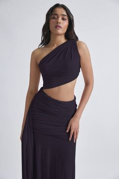 Dark grey malai lycra and net ruched one-shoulder dress with an asymmetric hemline, side cut-out and flared detailing. - Aza Fashions Ruched Pre-draped Asymmetrical Dress For Night Out, Ruched Asymmetrical Dress For Evening With Asymmetrical Neckline, Pre-draped Ruched Asymmetrical Dress, Evening Asymmetrical Dress With Ruched Detail, Stretch Draped One Shoulder Party Dress, Asymmetrical Ruched One Shoulder Top For Night Out, Asymmetrical Party Dress With Ruched Bodice, Party Asymmetrical Dress With Ruched Bodice, Asymmetrical Ruched One-shoulder Gala Dress