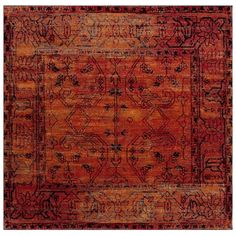 an orange and black rug with ornate designs on the bottom, in different shades of red