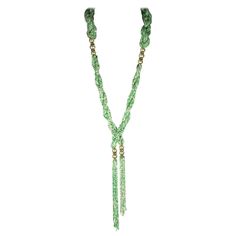 Long French Art Deco 1920s Lariat composed of multi strand, braided twists of opaque faux jade and pearl micro seed beads. Beautifully crafted with hand blown glass faux pearl and crystal paste rondelle spacers, terminating with two focal looped micro bead tassels. Made In France, 1920's. Excellent Condition. Luxury Green Lariat Necklace, Adjustable Green Beaded Lariat Necklace, Elegant Adjustable Green Lariat Necklace, Green Braided Bohemian Jewelry, Braided Twists, Blood Gang, Dramatic Necklace, Necklace Drawing, Pearl Lariat Necklace