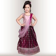 Introducing our exclusive Pink and purple lehenga Choli for little Girls! This dazzling outfit is perfect for any special occasion. The georgette Lehenga in purple with sequin embroidery is simply beautiful, and the contrast pink Choli with delicate embroidery is absolutely stunning. The shaded dupatta completes the look and makes this outfit truly exquisite. Your little girl will feel like a princess in this gorgeous outfit! #chirosbyjigyasa #indianclothingusa Purple Sequined Dress For Diwali, Purple Sequin Dress For Eid, Purple Party Wear Dress With Dupatta, Purple Resham Embroidery Party Dress, Purple Party Dress With Resham Embroidery, Purple Sequin Sharara For Diwali, Eid Sequinned Purple Sets, Eid Purple Sequin Sets, Purple Sequined Sets For Eid