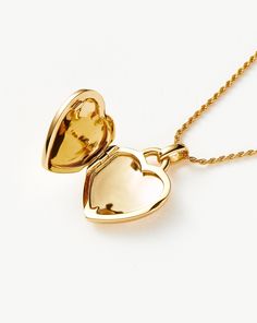 Engravable Heart Ridge Locket Pendant Necklace | 18ct Gold Plated Vermeil/Rainbow Moonstone. Make It Personal with this Engravable Pendant Necklace. Paired with a Delicate Chain, the Heart-Shaped Locket Features a Central Rainbow Moonstone Gem and Signature Ridge Detailing. It Can be Engraved on the Back, as Well as Inside the Locket. Add a Date, Meaningful Message or Personalized Motif to Create a One-Of-A-Kind Jewelry Gift. Please Note: Engraving Items May Take 7-10 Working Days to Process. Me Yellow Gold Gemstone Heart Necklace For Anniversary, Yellow Gold Heart Necklace With Gemstone, Anniversary Yellow Gold Heart Necklace With Gemstone, Gold Gemstone Heart Necklace For Wedding, Dainty Yellow Gold Heart Pendant Locket Necklace, Gold Plated Heart Pendant Locket, Gold Plated Heart Pendant Locket Jewelry, Yellow Gold Gemstone Heart Necklace In Sterling Silver, Luxury Heart-shaped Jewelry For Anniversary Gift