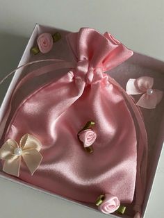 a pink gift bag with flowers on it