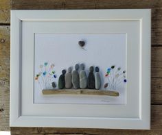 a group of rocks sitting on top of a wooden shelf