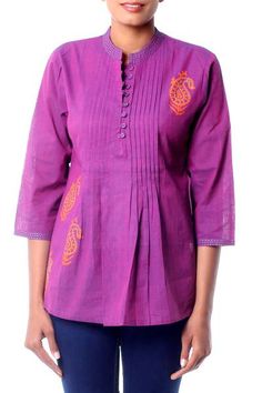 Designed by India's Isha Jain this festive blouse features a mandarin collar and pin tucks down the front which give it an easy fitting grace. Embellished with block prints applied by hand and kantha or running stitch embroidery the colorful tunic goes everywhere with Indian style. Traditional Straight Kurta With Pintucks, Traditional Festive Kurta With Pintucks, Festive Traditional Kurta With Pintucks, Traditional Cotton Top With Stand Collar, Fitted Long Sleeve Block Print Tops, Traditional Pintucks Kurta, Spring Long Sleeve Kurta With Pintucks, Festive Casual Cotton Blouse, Spring Long Sleeve Pintuck Kurta