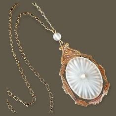 Beautiful Large 1920s Art Deco Antique Camphor Glass Brass Pendant Necklace. The Pendant Has A Camphor Bead Accent And Drop Of 2" For A Total Drop Of 2 1/4". The Camphor Glass Oval Is 7/8" X 1 1/8", Prong Set In Frame And Is In Excellent Vintage Condition. Details: Center Faceted Sparkling Rhinestone. Secure Push Ring Clasp. Unsigned Beautiful Vintage/Antique Pre-Used Condition With Age Appropriate Wear. Please See Photos For Additional Details. Product Color May Differ Slightly From Photos Due To Differences In Color Monitors And Lighting. Smoke Free Home. Will Be Packaged And Shipped With Care. Bundle Your Favorites For A Great Discount Offer. Push Ring, Brass Pendant Necklace, Calendar Girls, 1920s Art, 1920s Art Deco, Brass Necklace, Discount Offer, Brass Pendant, In Frame