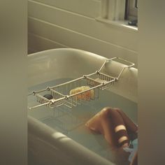 a person washing their hands in a sink