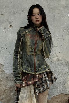 This vintage-inspired denim jacket is all about attitude. Featuring a distressed wash, frayed edges, and hand-finished details, it combines a fitted silhouette with street-style appeal. The high collar and bold zipper add a rebellious touch, making it... Acid Wash Outerwear With Frayed Hem For Fall, Vintage Long Sleeve Outerwear With Frayed Hem, Vintage Outerwear With Frayed Hem And Long Sleeves, Faded Grunge Outerwear For Spring, Faded Grunge Spring Outerwear, Fall Cotton Denim Jacket In Grunge Style, Fall Cotton Grunge Denim Jacket, Grunge Long Sleeve Stonewashed Outerwear, Faded Long Sleeve Outerwear With Frayed Hem