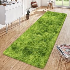 a green area rug in the middle of a room