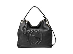 This black Gucci bag exudes luxury with its beautiful leather and gold-toned hardware. The famous interlocking GG logo is displayed proudly on the front. With a zipper pocket and two open pockets befitting of a phone, you'll have space to organize what you need to bring with you.     Model: 536194     Black Leather  Gold-tone Hardware  GG Soho  Top Zip Closure  Leather Shoulder Strap  Removable/Adjustable Shoulder Strap  Three Interior pockets  Strap Drop: 5"   Measurements: 13.5" x 5.5" x 13" ( Gucci Travel Bags With Gold-tone Hardware, Gucci Shoulder Bag With Logo Hardware For Business, Modern Gucci Bags With Zipper Closure, Gucci Travel Bags With Logo, Gucci Business Bag With Gold-tone Hardware, Gucci Shoulder Bag With Logo, Gucci Crossbody Bag With Logo, Gucci Bags With Logo For Everyday Use, Designer Gucci Shoulder Bag With Logo