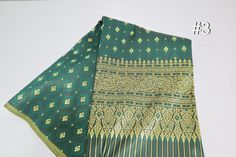 This fabric is just a material for sewing sarong, pants, or other crafts. It's not a readymade sarong and we sell by the yards. Therefore, buyers need to stitches and hem the edge before use as a sarong. Size: 1 unit = 40 inches wide x 35 inches long (100 cm x 90 cm) 2 units = 40 inches wide x 70 inches long (100 cm x 180 cm) 3 units = 40 inches wide x 105 inches long (100 cm x 270 cm) 4 units = 40 inches wide x 140 inches long (100 cm x 360 cm) Texture: Medium soft, shiny Material: faux silk, s Khmer Party Dress, Traditional Laos Wedding Dress, Khmer Wedding Dress, Damask Art, Sarong Pants, Wedding Dress Material, Thai Wedding Dress, Thai Wedding, Sarong Skirt