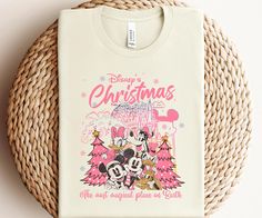 a white t - shirt with mickey and minnie mouse's christmas wishes on it