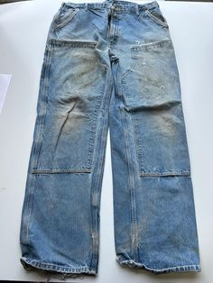 Mens Carhartt Double Knee Trouser Heavy duty material 1990s vintage  Regular Fit  Zip Fly  Blue Waist 40 inch Leg Length 35 inch **Sizes are exact measurement of the jean and may differ from the tag size** Please note due to the nature of these being workwear jeans there will be cool signs of fraying / paint and fading marks. All adding to the character of the piece** Item in great workwear condition overall Vintage Straight Leg Cargo Pants For Streetwear, Vintage Full-length Cargo Jeans For Streetwear, Vintage Full Length Cargo Jeans For Streetwear, Vintage Full Length Cargo Pants For Streetwear, Vintage Cotton Cargo Jeans With Five Pockets, Vintage Five Pockets Pants For Streetwear, Vintage Full-length Cotton Cargo Jeans, Vintage Straight Leg Cargo Pants With Five Pockets, 90s Style Faded Bottoms With Pockets