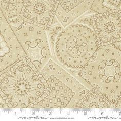 a beige and white background with an intricate design on it's fabric, as well as