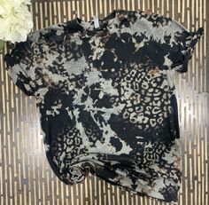 Check out our trendy acid wash leopard cheetah t-shirt, now available in Adult Unisex Long Sleeves! Our Simply Sun Bleached Next Level Acid black wash distressed t-shirts are super soft and comfortable for everyday wear. High quality Next Level t-shirts are made to order and each t-shirt is unique.  Colors will range from browns to tans to greys.  Please note acid wash shirts will vary, we cannot duplicate a photo. Each Shirt will have a unique acid wash design and colors. From browns to tans to Leopard Bleach Shirt, Black Tiger Print Crew Neck Top, Black Crew Neck Top With Tiger Print, Black Bleached Relaxed Fit Tops, Hand Dyed Black Short Sleeve T-shirt, Summer Bleached Black T-shirt, Black Bleached T-shirt For Summer, Summer Black Bleached T-shirt, Black Hand-dyed Short Sleeve T-shirt