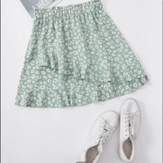 A Cute Short Floral Skirt. High Waisted And Flowing. Mint Green And White. Never Worn. Green Bottoms With Ruffle Hem, Green Skirted Bottoms With Ruffle Hem, Green Ruffled Skirt For Day Out, Casual Ruffle Hem Skort, Casual Green Ruffled Skirt, Green Casual Skirt With Ruffles, Casual Green Skirt With Ruffles, Green Ruffled Mini Skirt For Day Out, Green Ruffled Skort For Spring