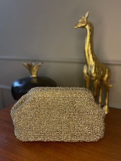 If you're looking for a glamorous and trendy accessory for your next party or event, a glitter party clutch bag made with sparkle yarn may be a perfect choice.  The use of sparkle yarn in the design of the clutch bag makes it perfect for adding some shine and glam to your outfit. The bag is covered in glitter which shimmers and reflects light beautifully, making it a great accessory for special occasions like weddings, parties, and proms. The glitter party clutch bag has a classic and timeless d Gold Clutch Bag, Crochet Clutch Bags, Sparkle Yarn, Woven Clutch, Glitter Clutch, Cloud Bag, Gold Clutch, Crochet Clutch, Glitter Party