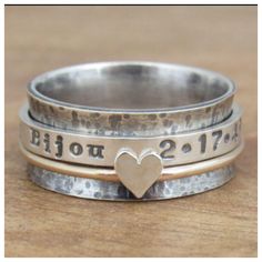 Personalized heart spinner ring ♥️  Solid Sterling Silver and Gold Filled band.  Two middle rings spin around main band. Shop link is in bio. #lovewhatido #handmadejewelry #spinnerring #fidgetring #heartring  #personalizedring #personalizedjewelry #fidgetjewelry #joyfullycrafted #etsyjewelry Stackable Promise Ring Band, Stackable White Gold Rings With Wide Band, White Gold Wide Band Stackable Promise Rings, Wide Band Fine Jewelry Gift, Fine Jewelry Wide Band As Gift, Fine Jewelry Wide Band For Gift, Heirloom Style Stackable Bands As A Gift, Heirloom Style Stackable Bands As Gift, Heirloom Stackable Bands For Gifts