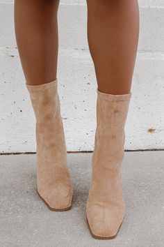 Sock style fitted ankle boot Shaped by a square toe. Back zipper closure. Lifted on a 4" block heel. Materials: Vegan Suede. This style runs true to size! This item is Final Sale. Beige Suede Ankle Boots, Trending Womens Boots, Khaki Ankle Boots, Fall Boots For Women, Fancy High Heels, Nude Boots, Elevated Fashion, Sock Style, Taupe Boots