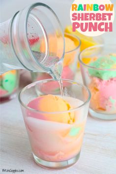 rainbow sherbet punch is being poured into small glasses