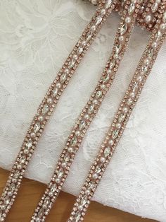 **Add a little sparkle to wedding dress, or as a bridesmaid belt! Highest quality crystal and beaded trim. The crystals are in a silver setting, approximately 1 cm wide and in a repeating pattern. **This gorgeous thin crystal rhinestone belt makes a perfect bridal belt, bridesmaids belt, or rhinestone hairband! The crystals are in a silver setting in a repeating pattern. Pricei is for one yard, there are 5 yards in one roll . Back to more rhinestone apploique selection https://www.etsy.com/shop/ Bridesmaid Belt, Wedding Belt, Wedding Sash Belt, Rhinestone Cross, Rhinestone Belt, Bridal Sash, Beaded Belt, Wedding Belts, Rhinestone Headband