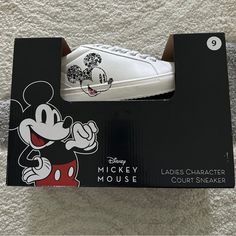 New In Box Disney Mickey Mouse Ladies Character Court Sneakers Size 9 Black Mickey On Side Of Sneaker Box May Be A Little Scratched But Shoes Brand New Disney White Sneakers With Mickey Mouse Detail, Disney White Sneakers With Mickey Mouse, White Disney Mickey Mouse Sneakers, Disney White Mickey Mouse Sneakers, White Low-top Mickey Mouse Sneakers, Mickey Mouse Synthetic Sneakers For Streetwear, Disney Mickey Mouse Low-top Sneakers, Black Mickey Mouse Sneakers For Streetwear, White Sporty Mickey Mouse Sneakers