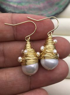 "This pearl is genuine freshwater pearl, 100% real pearl pearl luster: high+ metal: alloy plated 14k solid gold(it's high quality) pearl color: white,please look at picture Back to Other Jewelry Section 01: \"Flameball Pearl\" Section： https://www.etsy.com/shop/WenPearls?section_id=22535705 02: \"Edison Pearl\" Section: https://www.etsy.com/shop/WenPearls?section_id=18890242 03: \"Keshi Pearl\" Section: https://www.etsy.com/shop/WenPearls?section_id=22535725 04: \"Various Baroque Pearl\" Section White Baroque Pearl Earrings With Pearl Charm, Handmade Pearl Pendant Earrings For Jewelry Making, Pearl Pendant Earrings For Jewelry Making, White Gold Plated Dangle Pearl Earrings, White Baroque Pearl Earrings, Round Shape, White Gold-plated Dangle Pearl Earrings, White Pearl Charm Earrings In Metal, Gold Akoya Pearl Earrings With Ear Wire, Metal Drop Pearl Earrings For Anniversary