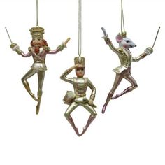 three ornaments hanging from strings in the shape of mice