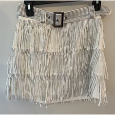 Get Ready To Show Off Your Western Style With This Beautiful White Skort. Made Of A Comfortable Blend Of Polyester And Spandex, This Skirt Features A Solid Pattern With Silver Accents And Fringe Detailing. The Skirt Is Designed With A Mini Length And Comes With A Stylish Belt To Complete The Look. This Size Large Skort Is Perfect For Any Cowgirl Who Wants To Add Some Nashville Flair To Her Wardrobe. Whether You're Going Out Dancing Or Just Running Errands Around Town, This Skirt Is Sure To Turn Rhinestone Fringe Belt, Black Midi Pencil Skirt, Tweed Midi Skirt, Cowgirl Skirt, Fringe Belt, Strapless Denim Dress, White Skort, Rhinestone Fringe, Fringed Belt