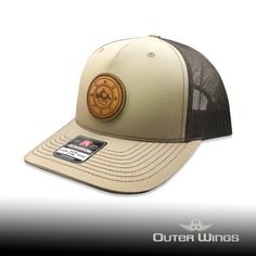 Embark on your next adventure with our exceptional Richardson 112 leather patch hat featuring the unique Outdoor Compass design on a circle patch. Precision laser engraved and expertly stitched, this hat combines style and functionality seamlessly. The 112 Richardson is a top-selling hat style, boasting an adjustable SnapBack for a perfect fit for most head sizes. At our shop, we prioritize quality, ensuring that each hat we provide is crafted with care and attention to detail. Our commitment to excellence shines through in the durable stitching and genuine leather patch. Available in a variety of colors, the Outdoor Compass design adds a touch of outdoorsy charm to your look. Unlike other brands that use fake leather and heat press their patches, we take pride in sewing each patch on for Casual Hats With Leather Patch - One Size, Leather Six-panel Baseball Cap With Leather Patch, Laser Engraved Leather Hat Patches, Adjustable 5-panel Baseball Cap With Leather Patch, Outdoor 5-panel Baseball Cap With Leather Patch, Compass Design, Leather Patches, Compass, Trucker Cap