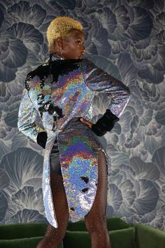 Holographic silver sequin jacket by Love Khaos. A tuxedo style tailcoat to keep you warm at festivals, rave wear, New Year’s Eve & Halloween costume parties. A circus tamer costume, wedding suit jacket & stage coat. A slim fit womens tailcoat with black velvet lapels collar & black velvet cuffs, shiny two-tone sequins & black buttons. Gift ideas for her. Burning Man, Coachella outfit, techno outfits & EDM festivals. A sequin coat for evening outfits & party coats Metallic Disco Outerwear For Party, Metallic Sequin Club Dress, Fall Club Sequin Dress With Long Sleeves, Metallic Sequin Party Outerwear, Glitter Outerwear For Party Season, Metallic Shiny Sequin Dress For Club, Metallic Sequined Party Outerwear, Metallic Sequined Outerwear For Party, Metallic Winter Party Outerwear