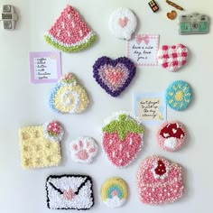 crocheted magnets are arranged on the refrigerator door for decoration or to decorate