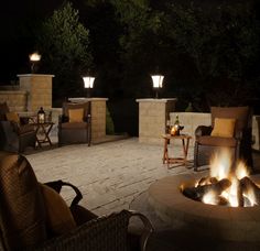 a fire pit sitting on top of a stone patio