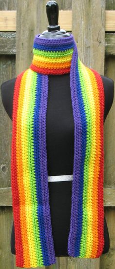 a multicolored crocheted scarf on a mannequin