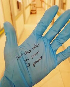 a blue glove with writing on it that says don't stop until you proud of yourself