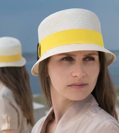 "\"Kami\" is pure elegance. The handmade hat is available in the high-quality \"parasisol\" with a lemmon yellow coloured hatband. Available in sizes 55 cm - 58 cm. Colour \"natur\" with a lemmon yellow coloured hatband and black accent Parasol hat (plaited straw) 66% cotton and 34% polyamide on the inside Ribbon of cotton and viscose Handmade Individualization options Other colours or sizes on request. All hats are handmade. For the production of a perfect hat it takes some time. All hats are r Modern Summer Hat With Curved Brim, Modern Curved Brim Hats For Summer, Modern Brimmed Summer Hats, Modern Summer Hat With Short Brim, Modern Beach Hats For Summer, Modern Short Brim Hat For Summer, Modern Flat Brim Summer Hat, Modern Brimmed Panama Hat For Summer, Modern Panama Hat With Curved Brim For Summer