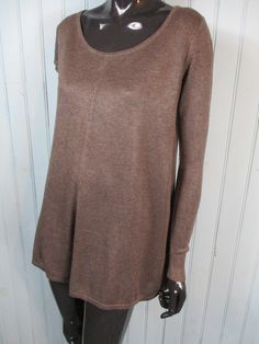 Brown A-line fine knit jumper size . It has a round neck, long sleeves, the back has a sheer black insert with a vinyl bow. It has a crew neck and long sleeves. Dimensions:   Bust: 38 Inches.  Length: 26 Inches. Sleeve:  20 Inches. Made by MILLENIUM Crew Neck Dresses For Fall Layering, Soft Knit Long Sleeve Fall Dress, Fall Layering Dresses With Crew Neck, Crew Neck Sweater Dress For Layering, Fall Crew Neck Sweater Dress For Layering, Chic Fall Sweater Dress With Crew Neck, Brown Knit Long Sleeve Sweater Dress, Chic Crew Neck Sweater Dress For Fall, Fall Crew Neck Sweater Dress In Soft Knit