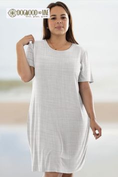 Introducing our Flora Perfect Tee Dress in Linen Canvas! Made from lightweight and breathable fabric, this dress is perfect for any casual occasion. The relaxed fit and classic design make it a versatile addition to your wardrobe. Whether you're strolling on the beach or running errands, this dress has got you covered. Casual Stretch T-shirt Dress For Summer, Casual Stretch Beach Dress For Spring, Casual Spring Stretch Beach Dress, Spring Stretch Casual Beach Dress, Relaxed Short Sleeve Summer Dresses, Casual Short Sleeve Beach Dress For Daywear, Casual Beach Dress With Short Sleeves, Flowy Short Sleeve Beach Dress, Casual Beach Dress With Short Sleeves For Daywear