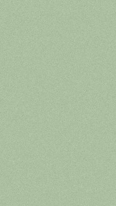 a light green wallpaper with some sort of texture