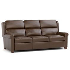 a brown leather couch sitting on top of a white floor