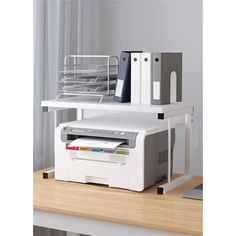 a white printer sitting on top of a desk