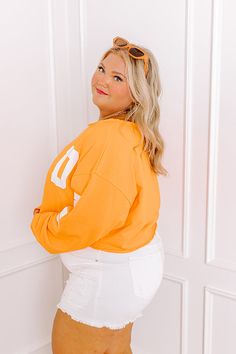 - Gear up for game day with this trendy crop sweatshirt! It's the perfect piece for cheering on your team or adding a sporty chic vibe to your casual wardrobe. - Unlined lightweight sweatshirt material with unfinished frayed seam accents - 'GAME DAY' lettering across the sleeves and front - A boat cut neckline - Long sleeves with ribbed cuffs - An ultra relaxed silhouette that ends in a cropped hemline - This piece is perfect for fans of Tennessee, Texas, Oklahoma State, and more! Oversized Sweatshirt For Game Day And Sports Season, Oversized Sweatshirt For Game Day, Oversized Sweatshirt With Ribbed Cuffs For Game Day, Collegiate Sweatshirt For Game Day In Fall, Collegiate Style Sweatshirt For Game Day In Fall, Oversized Varsity Sweatshirt For Game Day, Sports Fan Tops For Game Day In Spring, Collegiate Long Sleeve Sweatshirt For Game Day, Varsity French Terry Sweats For College