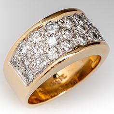 This beautiful wide band diamond ring is accented with twenty-three (23), bead set, round brilliant cut diamonds. The ring measures 9.6mm at the top, rises 4.4mm above the finger, tapering to 6.3mm wide and 1.3mm thick at the base of the soft European shank. It is currently a size 6. Luxury Yellow Gold Domed Wide Band Ring, Luxury Thick Band Dome Ring For Formal Events, Luxury Wide Band Diamond-cut Jewelry, Luxury Wide Band Jewelry With Diamond Accents, Modern Diamond Cocktail Rings, Thick Diamond Ring, Thick Diamond Band, Wide Band Diamond Ring, Wide Diamond Wedding Bands