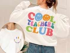 Cool Teacher Club Sweatshirt, Retro Teacher Sweatshirt, Cool Teacher Sweatshirt, Back To School Shirt, Teacher Gifts, Funny Teacher Sweater Welcome to Style Art US! 𝐒𝐈𝐙E  𝗔ND 𝐂𝐎𝐋𝐎𝐑𝐒: For  size and color options,  please see listing images. Gildan Brand, 50% cotton, medium weight and soft. Usually runs true size.  DTF printing method is used for these shirts. 𝗛𝗢𝗪 𝗧𝗢 𝗢𝗥𝗗𝗘𝗥: 𝟏. Please, check and review listing photos. 𝟐. Select Your T-Shirt size and color from drop down menus. 𝟒. Choose Your Quantity you want. 𝟒. Click 𝗔𝗗𝗗 𝗧𝗢 𝗖𝗔𝗥𝗧. Go to your card and finalize your order. CARE INSTRUCTIONS: Turn the shirt inside out. Machine wash cold with mild detergent. Tumble dry very low. Do not use bleach. Do not iron directly on design. RETURNS and CANCELLATION: If the i White Long Sleeve Fun Sweatshirt, Trendy Long Sleeve Tops With Funny Text, Fun Long Sleeve Slogan T-shirt, Fun Long Sleeve Slogan Tops, Cool Long Sleeve Cotton Tops, White Long Sleeve T-shirt With Funny Text, Fun Crew Neck Tops For College, Funny White Sweatshirt With Text Print, Fun Cotton Slogan Sweatshirt