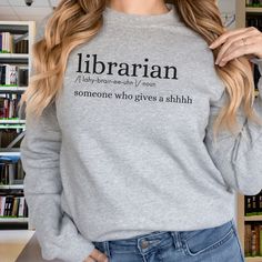 Embrace literary warmth with our Librarians Sweatshirt, a cozy and humorous tribute to the unsung heroes of knowledge. Crafted for book lovers and new librarians alike, this Crewneck Sweater is the perfect graduation gift, celebrating the magic of libraries with style and comfort.  Gildan Brand Sweatshirts Unisex Adult Sizing Rolled Sleeves in pictures are for styling purposes only Props used in photos are NOT included with purchase Ethics & Sustainability: https://www.gildan.com/us/en/sustainab Bookish Long Sleeve Sweatshirt Gift, Bookish Long Sleeve Sweatshirt As Gift, Bookish Crew Neck Sweatshirt As A Gift, Literary Long Sleeve Tops With Letter Print, Literary Long Sleeve Cotton Tops, Brand Sweatshirts, College Library, Reading Shirts, Digital Elements