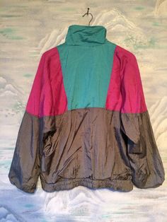 "Gray -Pink- Turquoise blue Windbreaker Sport Hipster Jacket Medium to Large Size Estimated size: M/L Measurements (lying flat): Length: 25.5\" / 65 cm Hips: 19,6\" / 50 cm elastic Width: 24,8\" / 63 cm (under arms down) Sleeve: 18,5\" / 47 cm Shoulders: 29,1\" / 74 cm Please check measurements to insure a proper fit. Remember to allow yourself some extra room for movement. You can compare these with something from your closet that fits you well. This jacket will come to you freshly laundered an Green Color Block Outerwear For Fall, Green Color Block Long Sleeve Outerwear, Green Long Sleeve Color Block Outerwear, Hooded Green Color Block Outerwear, Green Hooded Outerwear With Color Block, Green Hooded Color Block Outerwear, Green Color Block Outerwear For Outdoor, Green Color Block Outerwear For Spring, Retro Pink Windbreaker For Fall