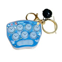 a keychain shaped like an electronic device with buttons on the front and sides