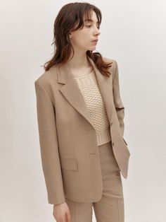 This is AVA MOLLI’s classic tailored jacket with a basic design. Designed with a semi-oversized fit, it creates a slight waistline when worn, making it a charming jacket that combines mannishness and femininity. It's designed to feel light and fresh when worn. This jacket stands out with delicate and comfortable wearability, as well as the soft slub texture that adds a natural charm.- It's a great item for daily wear- It can be paired with various styles of outfits to create different looks- The buttons on the front can be unfastened for versatility- The pockets on the front add practicality Classic Neutral Outerwear For Office, Classic Beige Blazer With Notch Lapel, Classic Beige Outerwear With Suit Collar, Beige Classic Outerwear With Suit Collar, Classic Beige Single Breasted Blazer, Neutral Single Breasted Blazer With Notch Lapel, Timeless Beige Outerwear With Notch Lapel, Neutral Notch Lapel Outerwear For Office, Timeless Beige Blazer With Lapel Collar