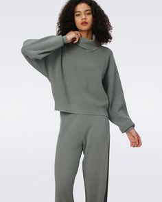 Made from a soft wool blend, the Jax knit pants are the definition of cozy chic. These effortless pants are cut for a high-waisted, comfortable fit with an elastic waistband. Pair them perfectly with the Angie sweater.Eloisa is 5 Foot and 8 Inches and wearing a size XS. Modern Loungewear Bottoms For Fall, Chic Winter Loungewear Sweatpants, Cozy Knit Wide-leg Pants, Winter Full-length Knit Pants, Cozy Full-length Pants With Ribbed Waistband, Pants With Ribbed Waistband And 4-way Stretch, Solid Ribbed Knitting Casual Sweater & Pants Sets, Wrap Dress Dvf, Midi Wrap Dress