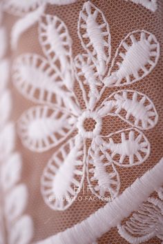 close up view of white lace on fabric